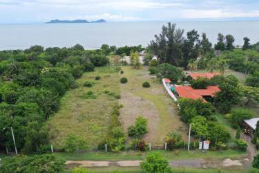 Aerial of Punta Chame vacant land with beach line and islands in background