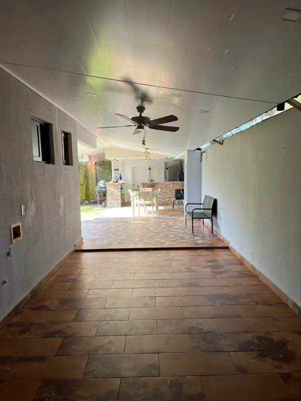 Kitchen with granite countertops wood cabinetry appliances marble accents in Versalles Panama