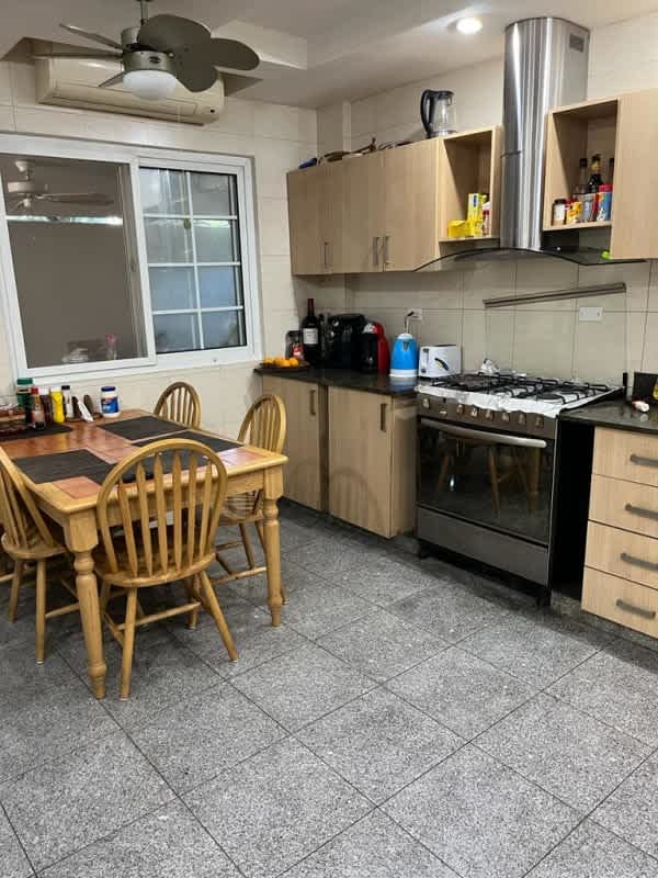 Bright open living dining room with marble floors and modern furniture Versalles I Panama