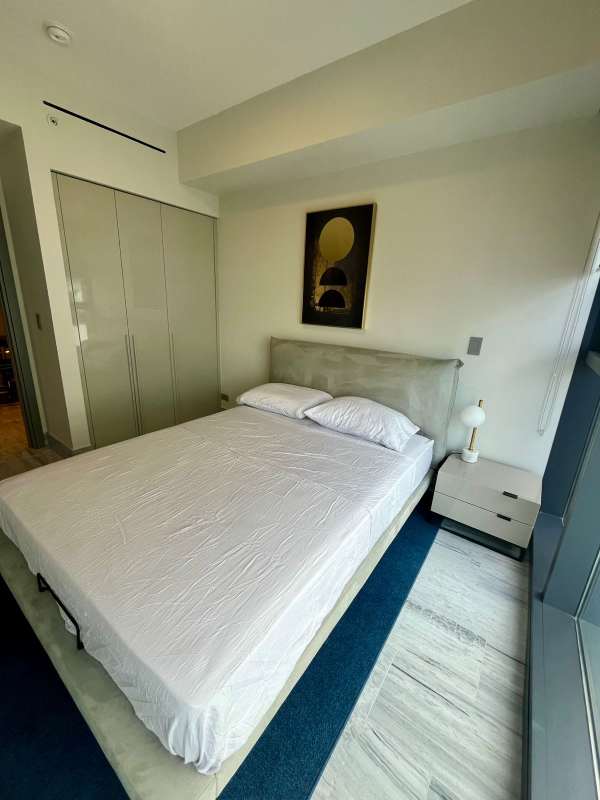 Luxury bedroom with large windows city views PH Nuovo by Armani Panama