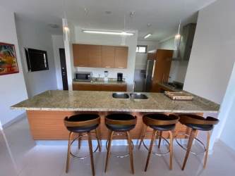 Covered balcony with garden views at PH Soleo Howard Panama Pacifico