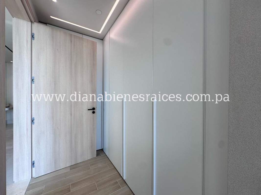 Luxurious master bedroom with floor-to-ceiling windows and Pacific Ocean view in Ocean Reef Islands Panama