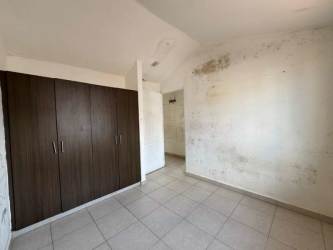 Bedroom featuring tile floors and wardrobe in single-family home Arraiján Panama