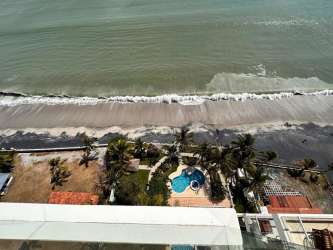 Infinity pool with ocean views and direct beach access at PH Biltmore Playa Malibu Panama