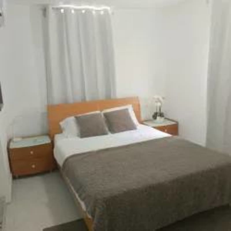 Kitchen with modern appliances, backsplash, cabinets in apartment for sale Rio Abajo Panama