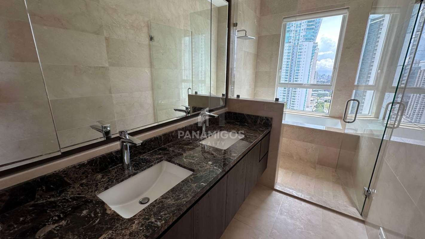 Bedroom with marble floor and large window offering ocean view PH Aria Panama