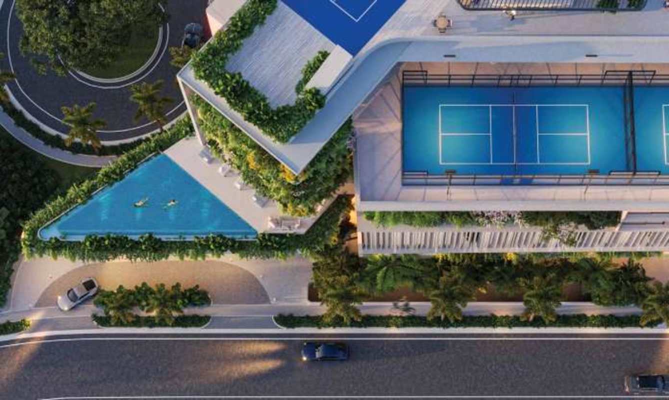 Aerial photo of rooftop pools and tennis courts at private island Ocean Reef luxury condominiums in Panama