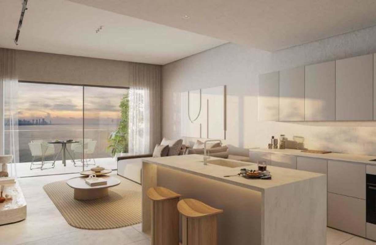 Modern private island residential tower with glass balconies and lush landscaping at Ocean Reef Panama