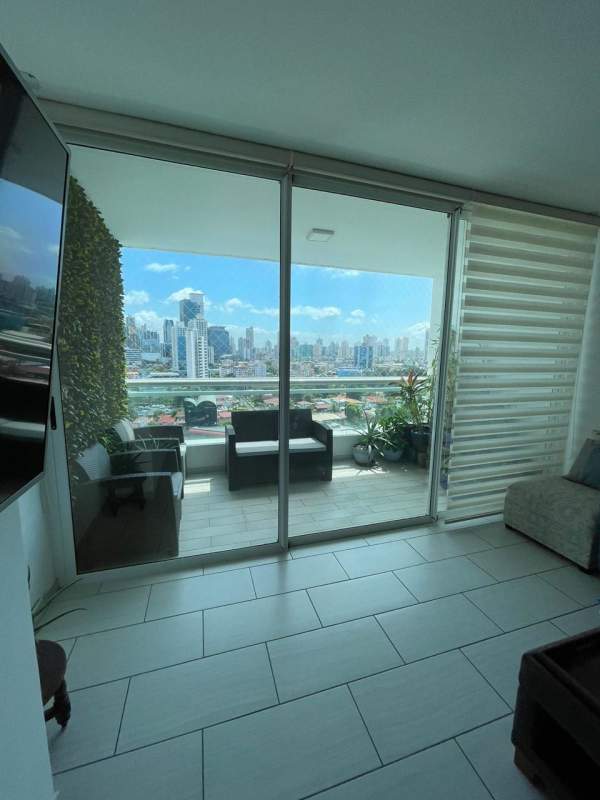 Spacious master bedroom with ensuite, large windows and blackout curtains at The Towers in San Francisco Panama