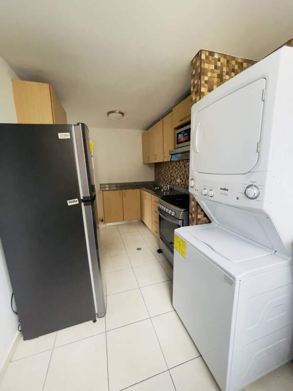 Living dining space opening to balcony with skyline view at PH San Francisco Skyline Panama