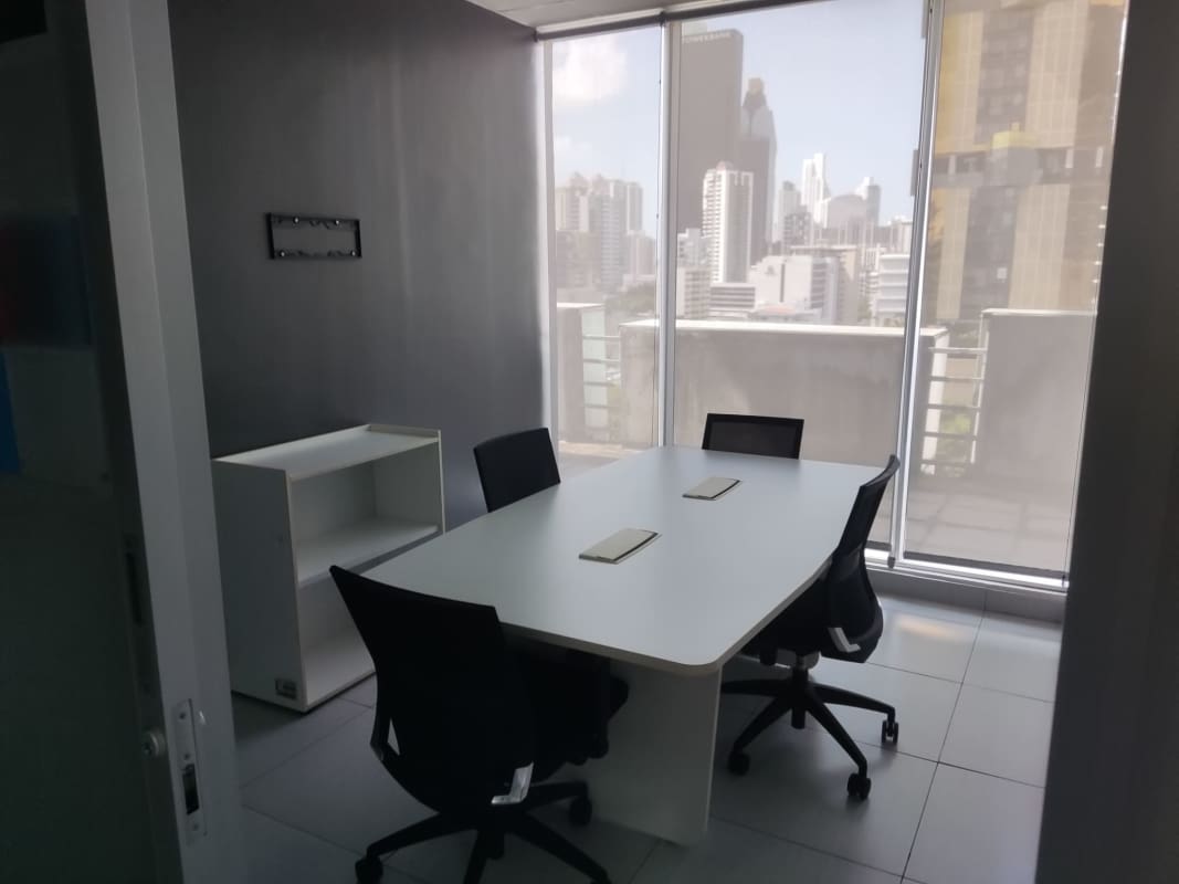 Contemporary office reception area with desk, accent wall art in commercial building Obarrio Panama