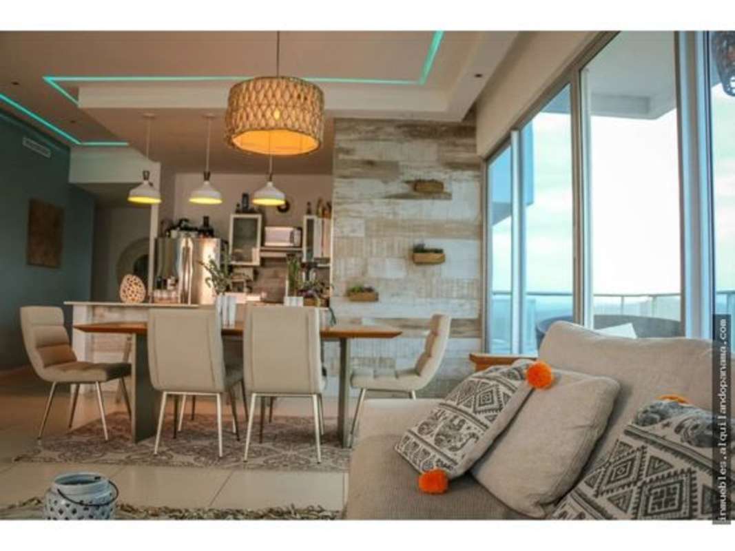 Bright open living dining with floor to ceiling windows and ocean views PH Sky Lounge Panama