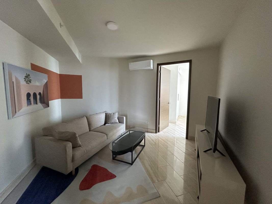 Modern living room with sofa, TV and AC at The Regent Costa del Este Panama City