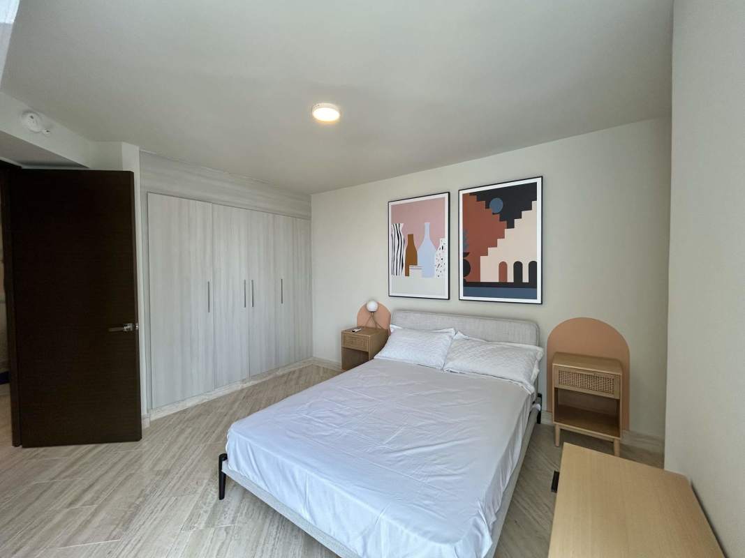 Minimalist modern bedroom with built-in closets at The Regent Costa del Este Panama