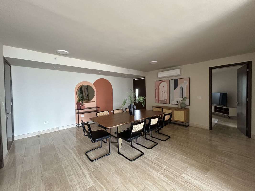 Furnished living room with ocean view balcony at The Regent Costa del Este Panama