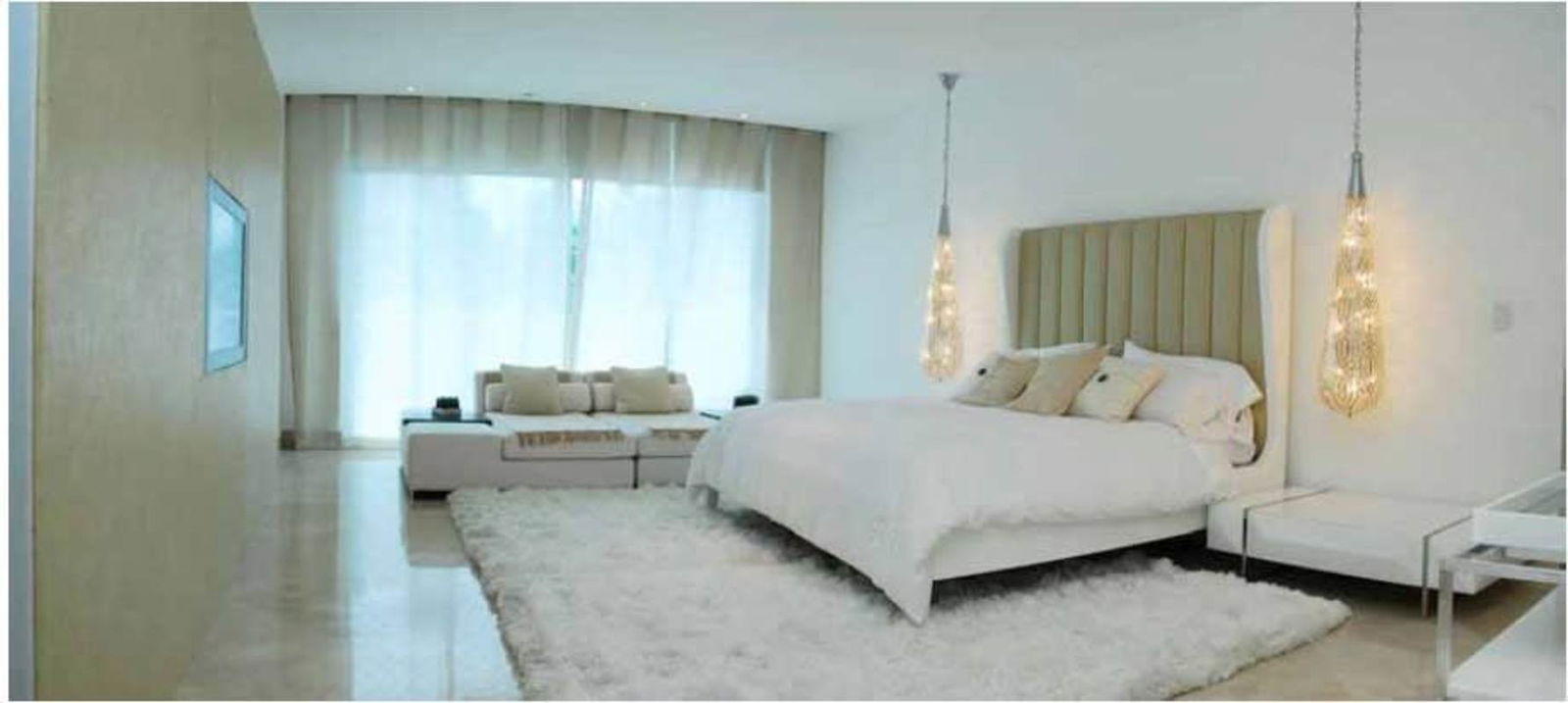 Master bedroom with floor-to-ceiling windows, upholstered headboard, sofa seating in PH Miradores Punta Paitilla