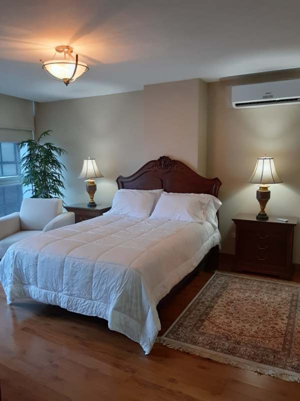 Living room with panoramic ocean and city views in PH Bayfront Avenida Balboa Panama City