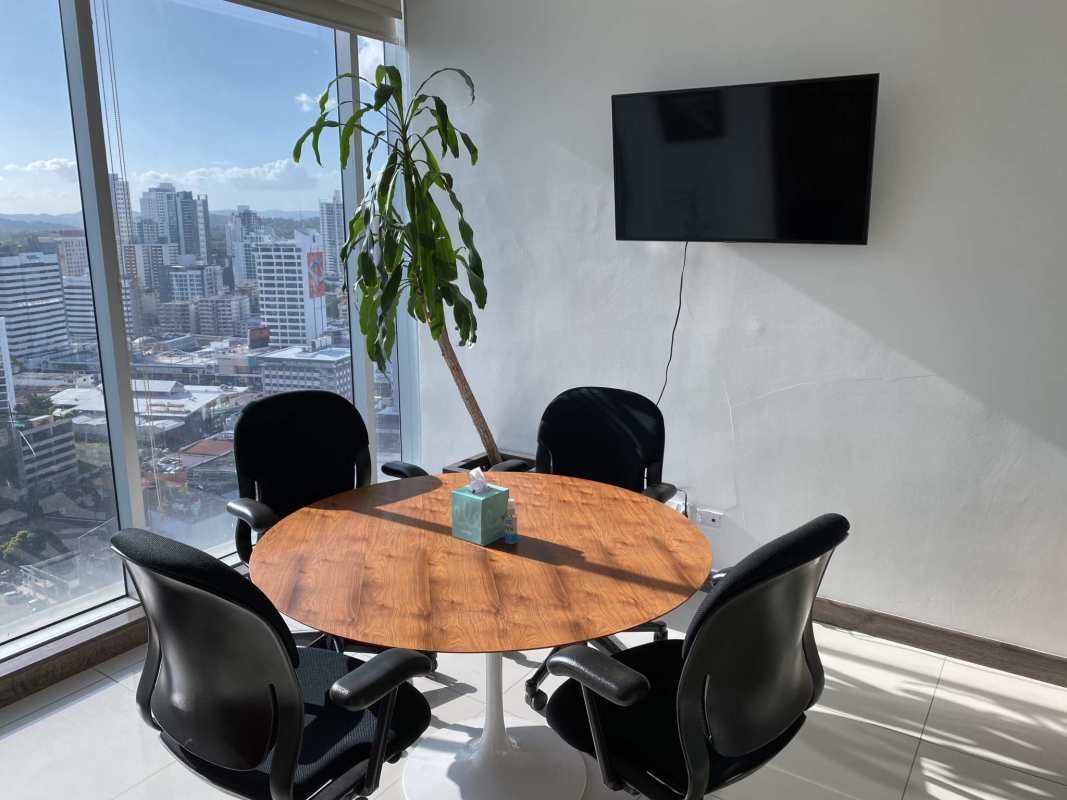 Open office space with sunny windows and central air conditioning at Atrium Tower in Panama City