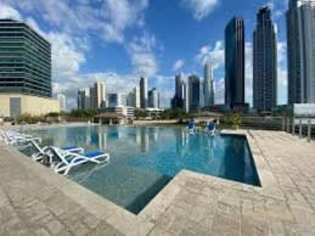 Infinity edge pool sunbeds skyline city view PH Sevilla Costa del Este