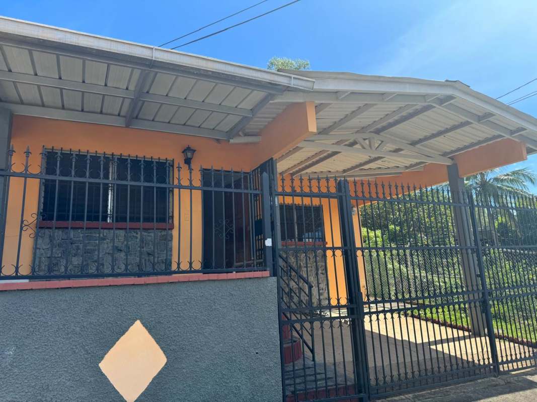 Functional kitchen with double sink, microwave and tiled backsplash in Condado del Rey Panama City