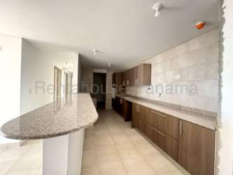 Large tiled balcony with glass railings facing Pacific ocean at Naiblú Residences San Carlos