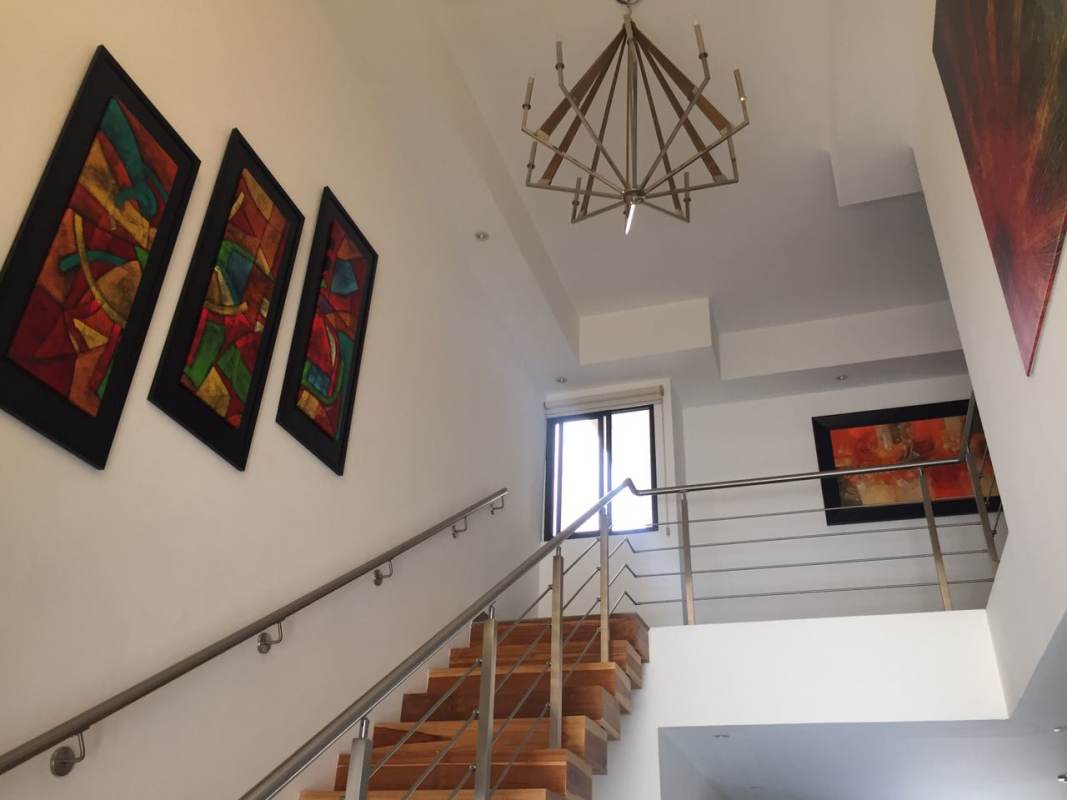 Modern open living area with glass doors to pool and patio Altos de Panamá Panama City