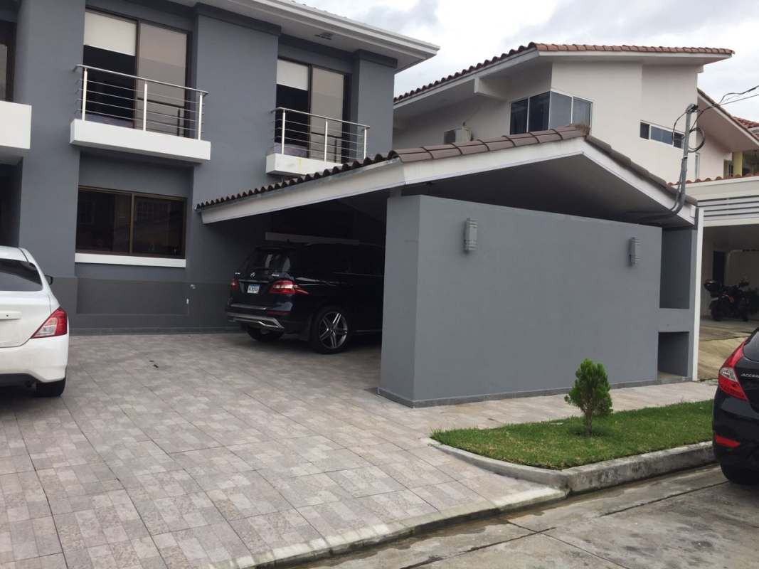 Front view of stylish 2-level house with balconies and driveway in Altos de Panamá Panama