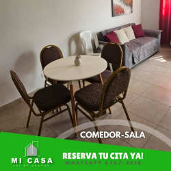 Open living dining with round table, chairs and gray sofa Penonomé Coclé