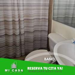 Bathroom with striped shower curtain, mirror and sink Penonomé rental house