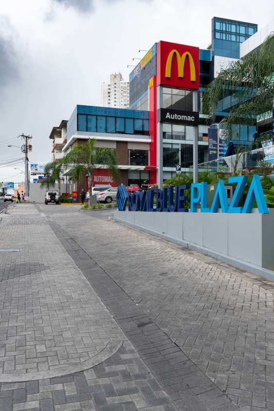 Exterior view of Royal Blue Plaza with McDonald's and glass frontage Panama City