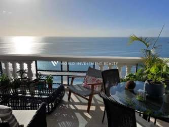 Spacious condo balcony with outdoor furniture and sweeping ocean views in Royal Palm Country Club Nueva Gorgona