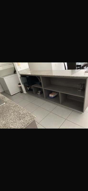 Compact kitchen with granite countertop and shelves PH Aviñon Towers Condado del Rey Panama