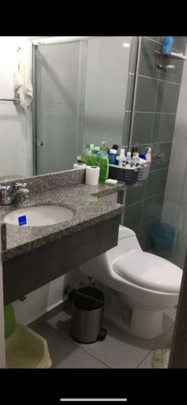 Compact modern bathroom granite countertop glass shower PH Aviñon Towers Panama