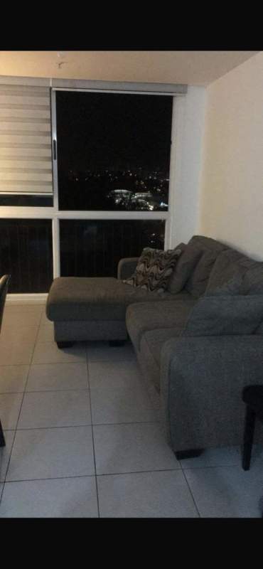 Bright living room with large window city skyline Condado del Rey Panama