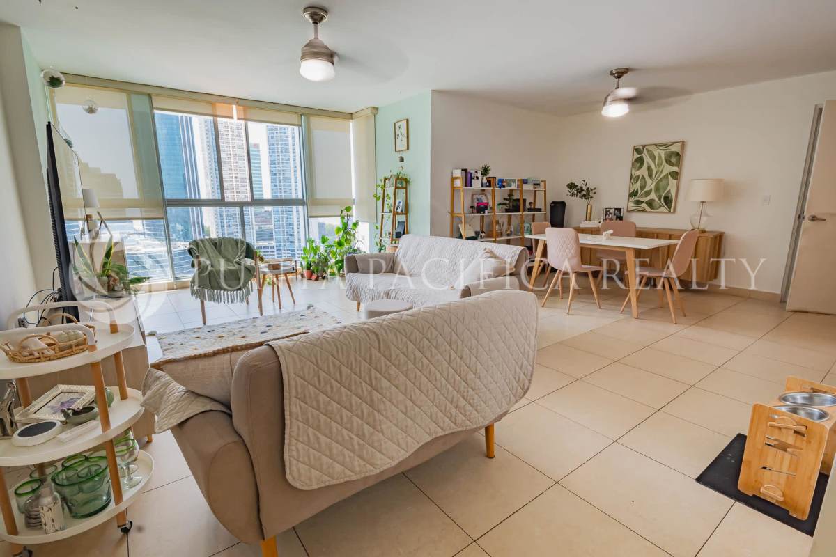 Modern dining space with city skyline backdrop in PH Costa View Costa del Este