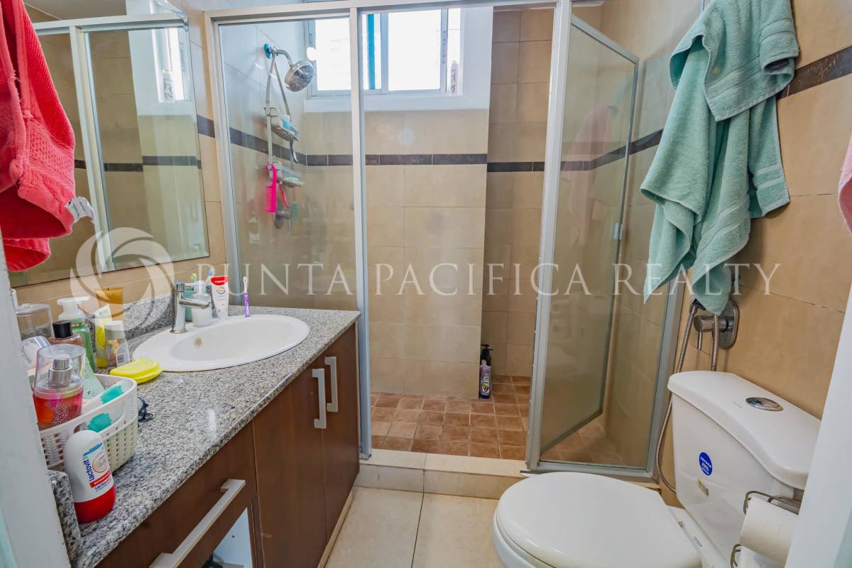 Kitchen with granite countertops, stainless appliances, overhead cabinets in PH Costa View Panama