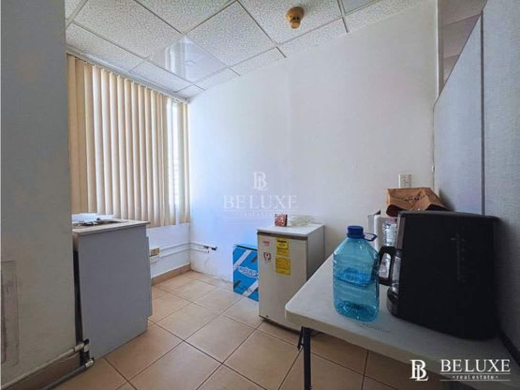 Small office kitchenette with fridge, coffee maker, window Plaza El Dorado Panama