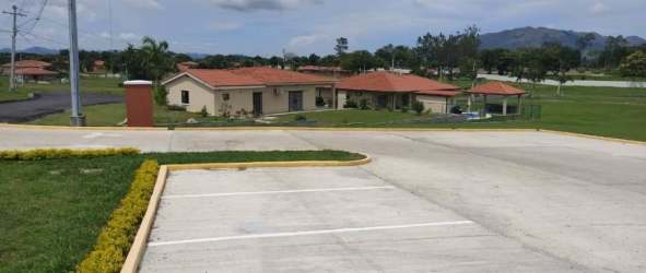 View of single-story Mediterranean homes with tile roofs in PH El Celaje Chame