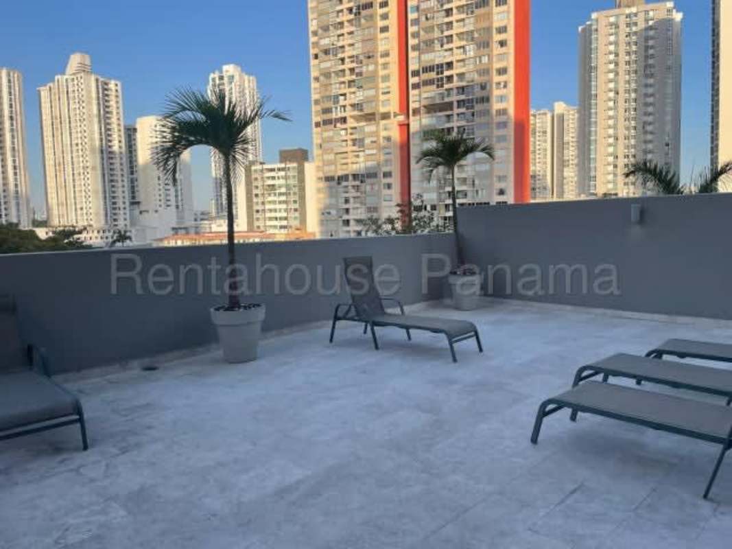 Open living area with large sliding doors towards balcony PH Altos del Golf Panama