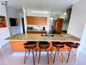 Spacious bedroom with balcony and garden views in PH Soleo Panama