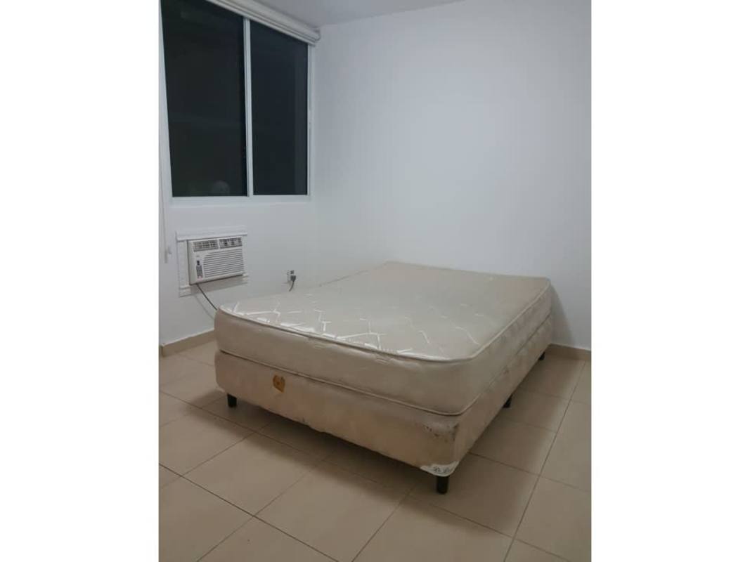 Minimal furnished bedroom tiled floor AC wall unit window with blinds PH Pacific Blue Punta Pacifica Panama