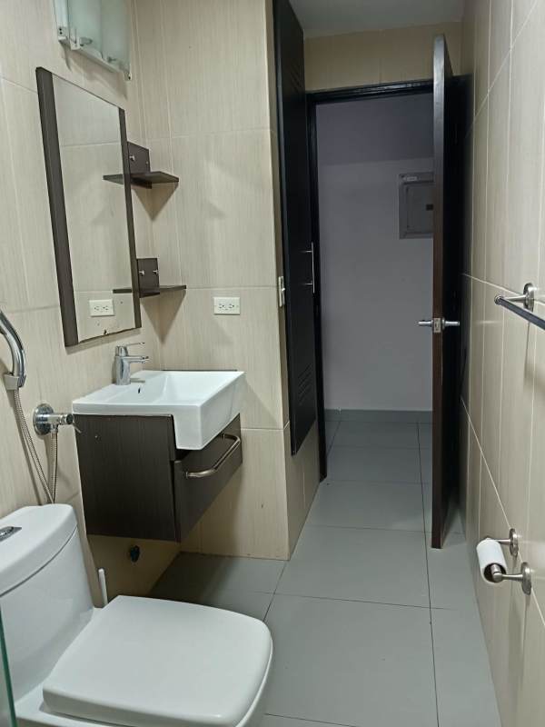 Minimalist bathroom with glass shower, wall-mounted sink in PH Colores de Bella Vista Panama