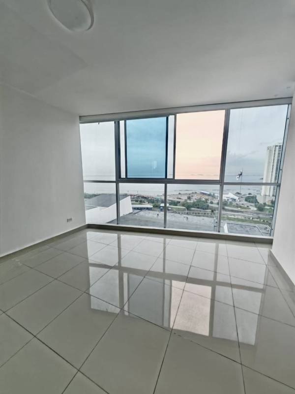 Serenity rooftop pool with lounge chairs and Panama City skyline background
