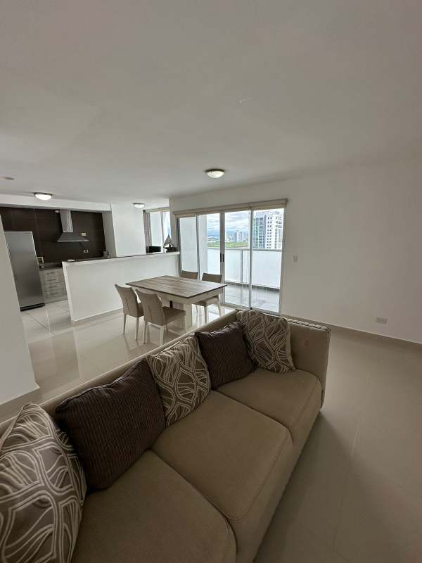 Spacious living and dining room with sliding glass doors to balcony PH Moon Tower Panama