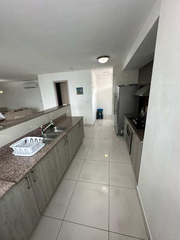 Modern kitchen setup with granite, double sink, range and stainless appliances Panama