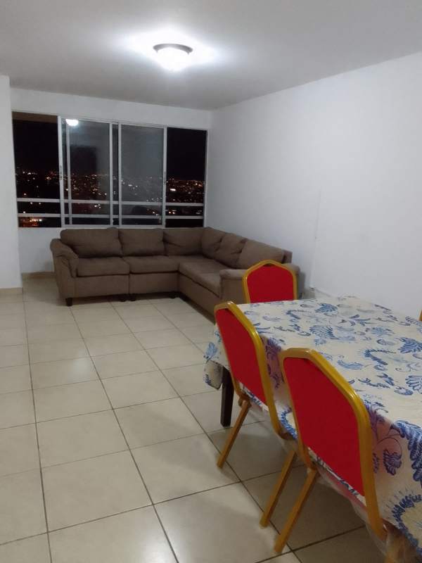 Rooftop swimming pool with lounge chairs city skyline view apartment PH Victoria Hills Panama