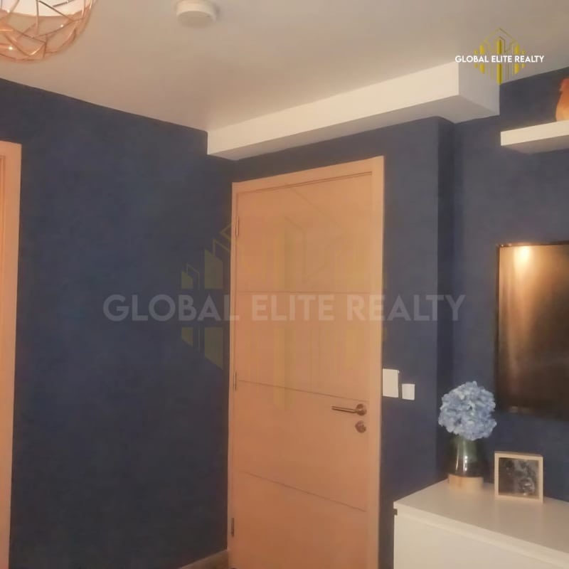 Living room with beige sofa blinds and modern decor PH Vía España Panama