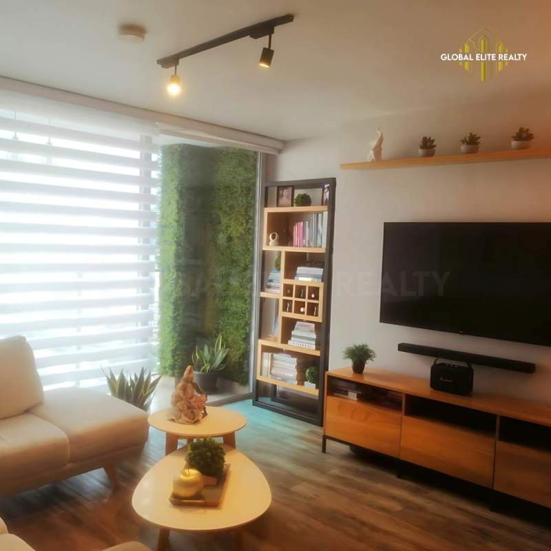Bright apartment hallway with white doors and plants in Vista Hermosa Panama