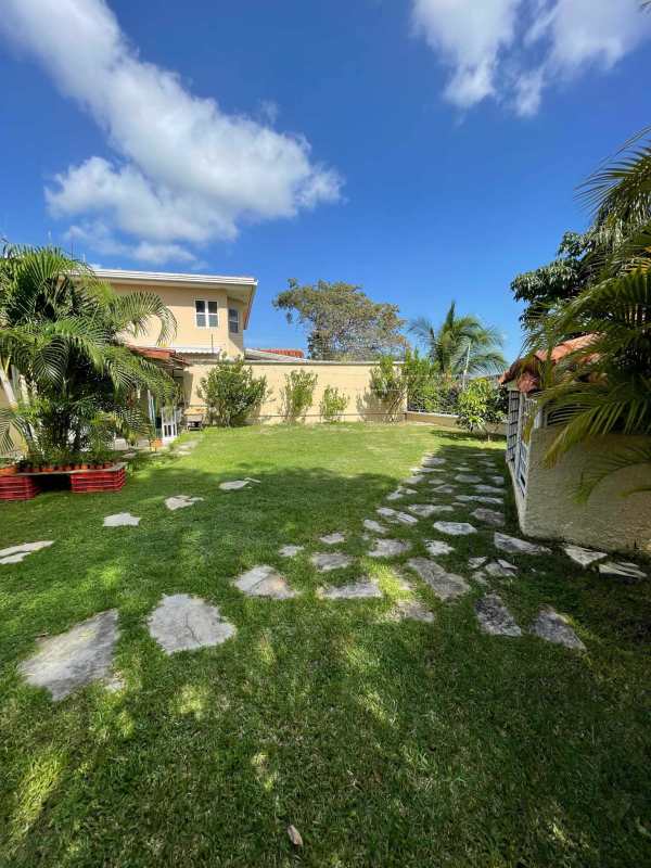 Modern kitchen with large countertops and wood cabinets in house at Brisas del Golf Panama