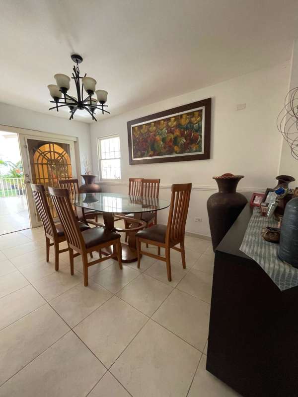 Covered terrace with panoramic garden view luxury house for sale Brisas del Golf Panama